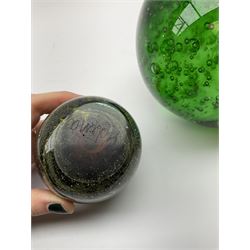 Group of glass paperweights, to include large green example with internal bubble decoration, four Mdina examples, etc. 