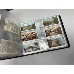 Eleven modern albums containing a large quantity of cigarette cards and trade cards, by Grandee, Abdulla & Co Ltd, W.D. & H.O. Wills, Dominion Tobacco, Senior Service etc, including motor cars, railway equipment, aeroplanes,  photographic and printed views etc, includes some reproduction cards and sets (11)