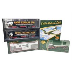 Corgi Eddie Stobart - four heavy haulage vehicles comprising 75201 ERF Curtainside; 75403 Leyland-DAF Curtainside; both in plastic display boxes; CC12610 Scammell Crusader 3 Axle Low Loader; and CC12502 Atkinson Borderer Flatbed Trailer; together with AA30008 Douglas DC-3 Aircraft; all boxed (5)