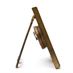 Early 20th century-Swiss bedside Strut Clock with an 8-day timepiece movement and balance escapement, four and a half inch square picture frame case with fine detail surround, gilt dial with exquisitely etched engraving to the corners and centre, silvered chapter with Roman numerals, inner minute track and elegantly fettled blue steel hands, wound and set from the rear.