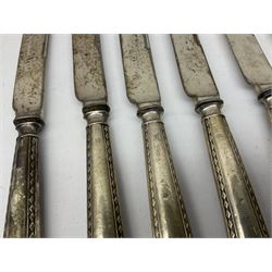 Set of six silver handled butter knives, and a silver handled shoehorn, all hallmarked, but hallmarks worn and indistinct