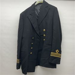 Two post-WWII British Army No.2 Dress tunics, one with Green Howards buttons; army shirt dated 1951; Royal Fleet Auxilliary jacket with trousers; three RAF/WAAF uniforms and RAF Greatcoat; and three canvas/webbing bags, two dated 1943 & 1945