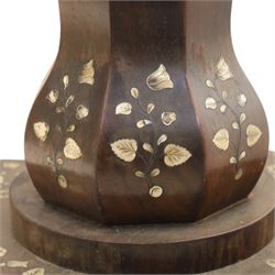 Victorian mahogany and mother-of-pearl inlaid work table, the octagonal hinged top enclosing a mirror and fitted compartmented interior, raised on a carved pedestal and quatriform platform base with scrolled feet