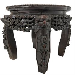 20th century carved hardwood jardiniere or plant stand, shaped circular top with inset marble surface and beaded border, pierced and carved apron with scrolling floral decoration, shaped supports applied with carved stylised flowers