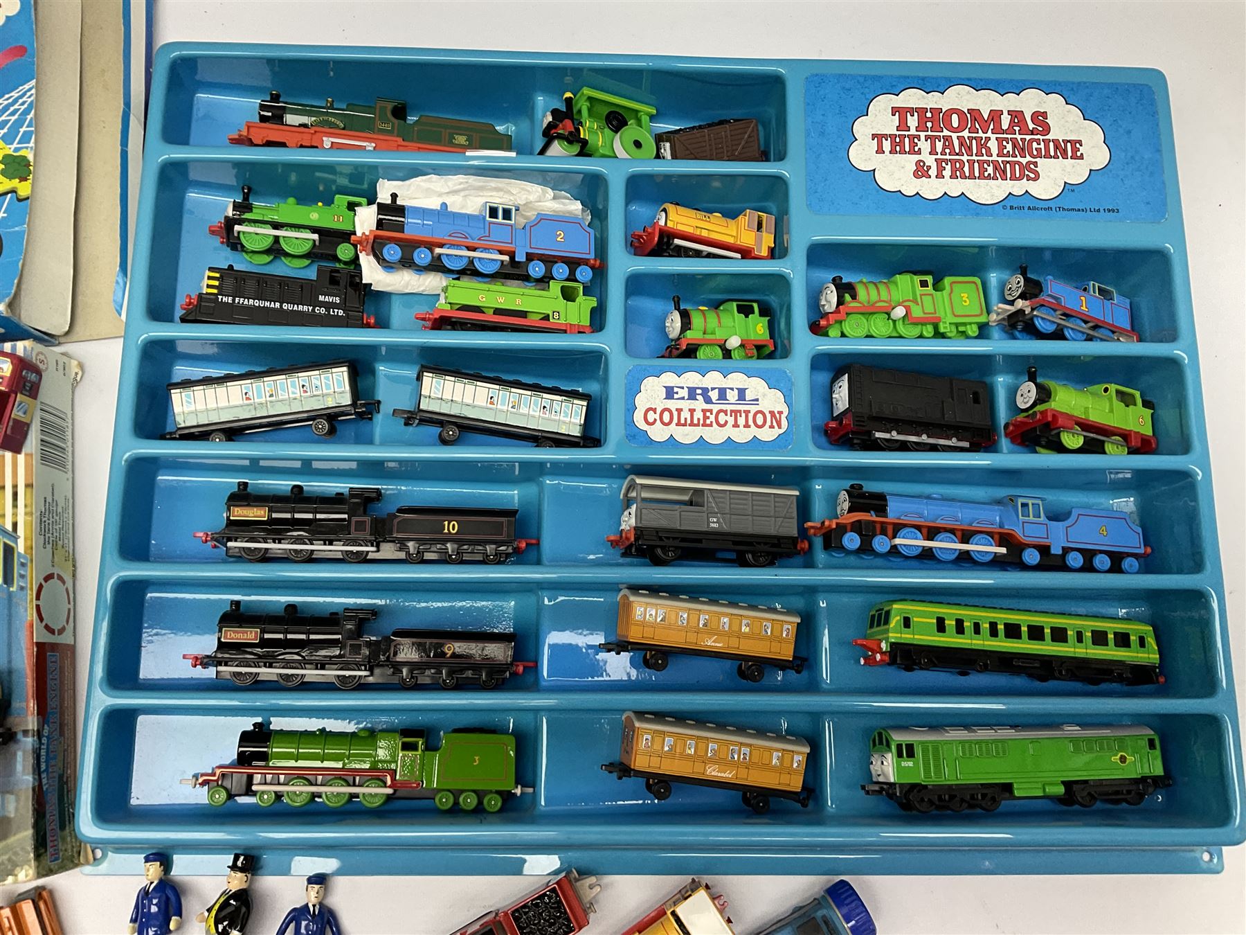 Thomas The Tank Engine and Friends - over forty unboxed models and figures by ERTL with moulded plastic wall mounting display rack; Hornby Clockwork Train Set; and Tomy Big Fun Jig-Saw Play Train; both boxed