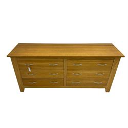 Contemporary wide oak straight-front chest, fitted with a bank of six drawers with chrome handles, on tapered feet