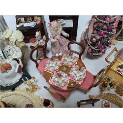 Dolls house living room and ding room furniture, including sofa, chair, long case clock, Christmas trees, fireplace, dresser, chairs, tables, mirrors, seven figures and a collection of predominantly Christmas themed decorations, food, etc