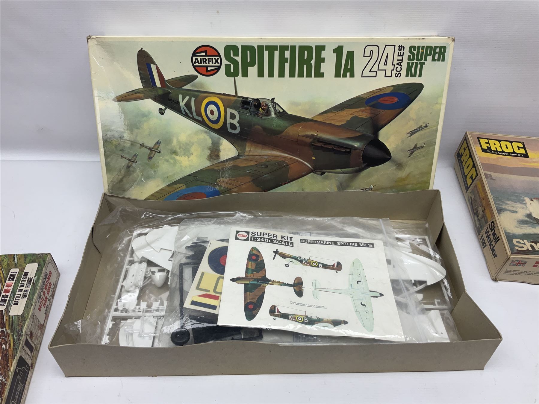 Three unmade construction kits - Airfix 1:24 scale Supermarine Spitfire Mk.1A; predominantly in unopened factory packaging with instructions and decal sheet; Frog Shell Welder with instructions; and Airfix Battle of Waterloo Farmhouse (instructions on box base); all boxed (3)
