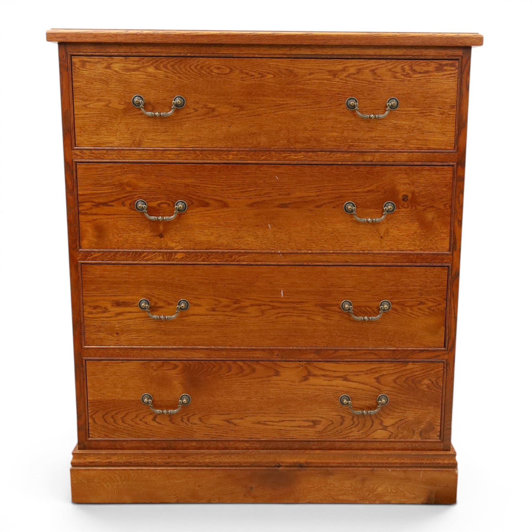 Cabinet-made oak chest, fitted with four soft-close drawers, brass swan neck handles and pierced backplates, on bracket feet