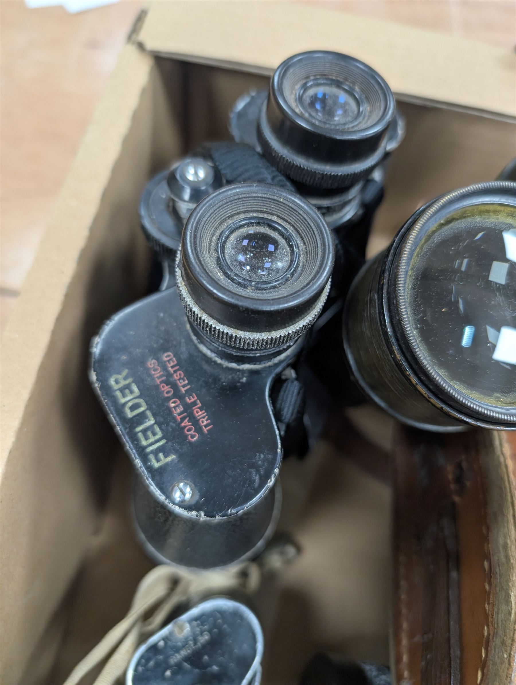Nine pairs of early 20th century and later binoculars, including Tento 20x50, Nagoya Panoramic 8 x 30, Orr & Sons Madras, DRW 10 x 50, etc some with cases