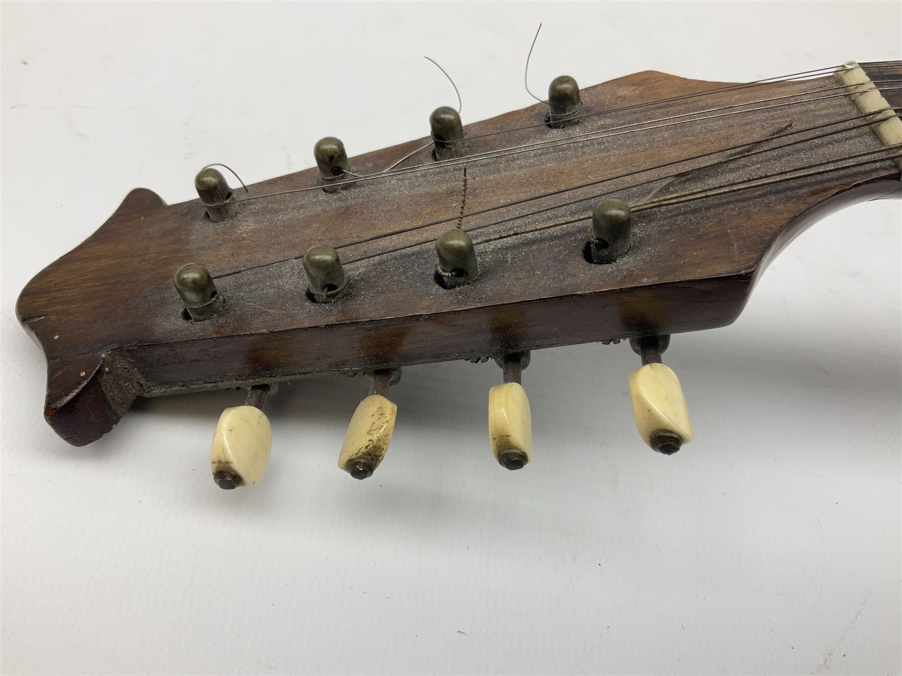 Italian mandolin, with foliate inlaid scratchplate, paper label inscribed 'Carlo Loveri & Figlio of Napoli', L62cm