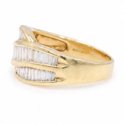 18ct gold diamond crossover ring, channel set with three rows of baguette cut diamonds, 1994
