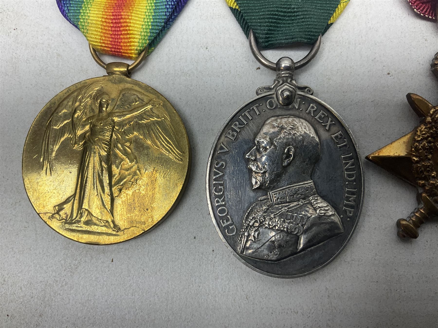 WW1 group of three medals comprising British War Medal, 1914-15 Star and Victory Medal awarded to 1270 Dvr. J. Fisher A.S.C.; and Territorial Efficiency Medal to T4-214571 Dvr. J. Fisher R.A.S.C.; all with ribbons (4)