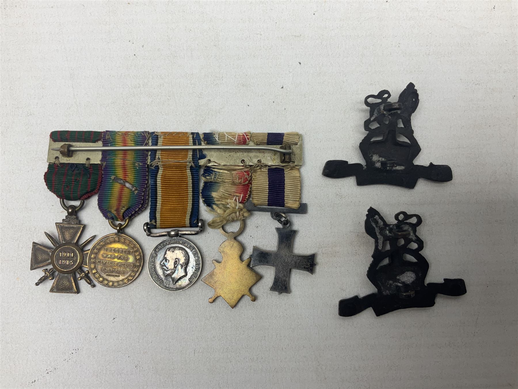 WW1/WW2 Military Cross group of five medals comprising M.C., 1914 Star with date clasp to 34156 Sjt. G. Ferguson R.F.A., British War Medal and Victory Medal with MID leaves to Major G. Ferguson, WW1 French Croix De Guerre with MID Star and WW2 Defence Medal; all with ribbons on pinned wearing bar; WW1 group of five miniature dress medals; two Royal West Kent cap badges; early 20th century silver cigarette case engraved with GF monogram and adapted as a photograph holder with image of Ferguson in civilian clothing; presentation Rotary 9ct gold cased wrist-watch with 1931 British Legion inscription verso; and archive of ephemera including 1914 MID certificate; WW2 Home Guard certificate; over twenty career spanning photographs of Regimental groups, portraits, Sandhurst etc; 1914 Commission document to 2nd Lieutenant; 11th Brigade R.F.A. Roll of Honour 1914-18; 'Soldier's Small Book'; Army Book 439 etc