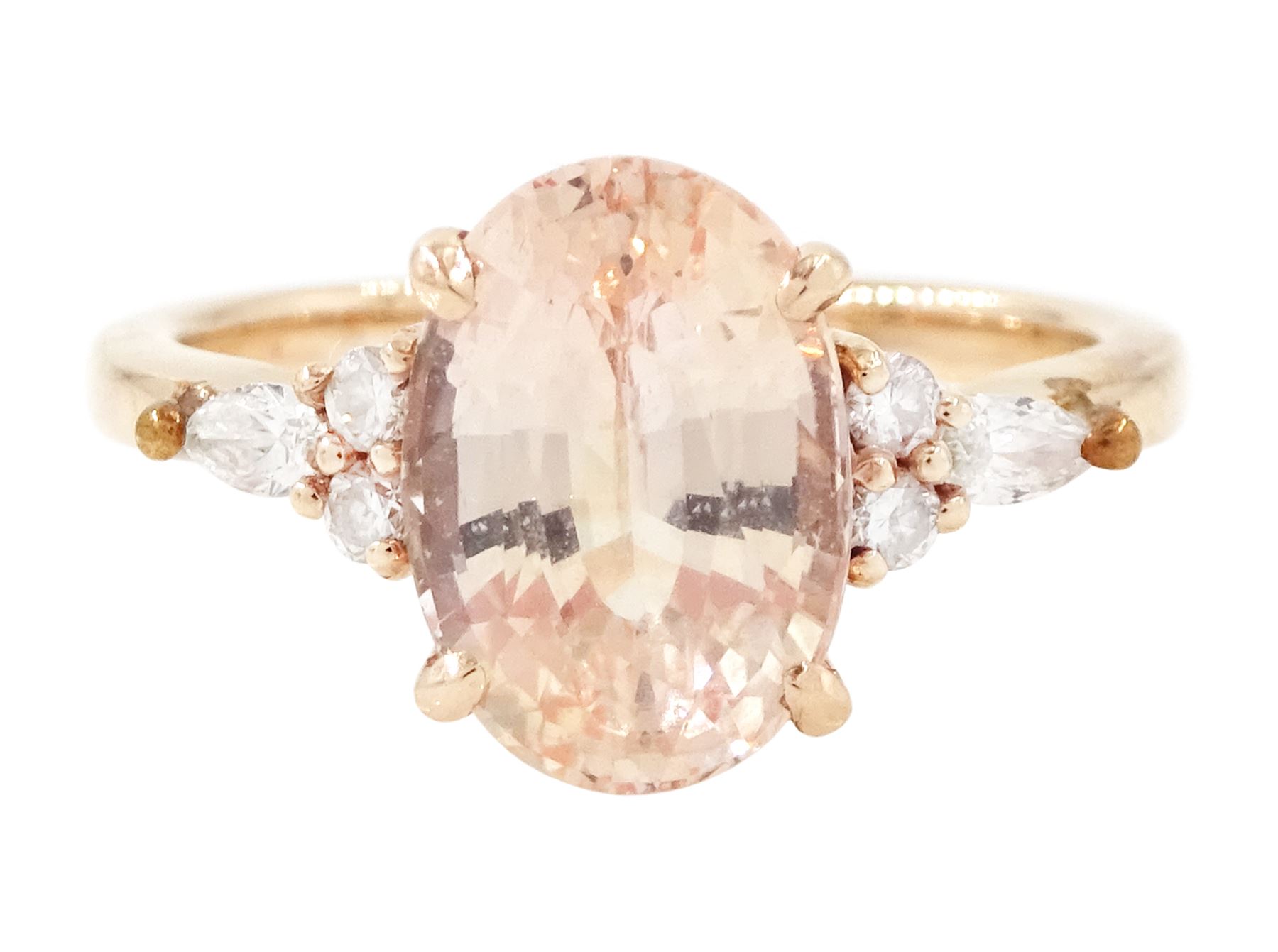 14ct rose gold pink / peach sapphire and diamond ring, single oval cut sapphire of 3.07 carat, with two round brilliant cut diamonds and a pear cut diamond set either side, stamped, total diamond weight 0.11 carat, with Gem Lab report