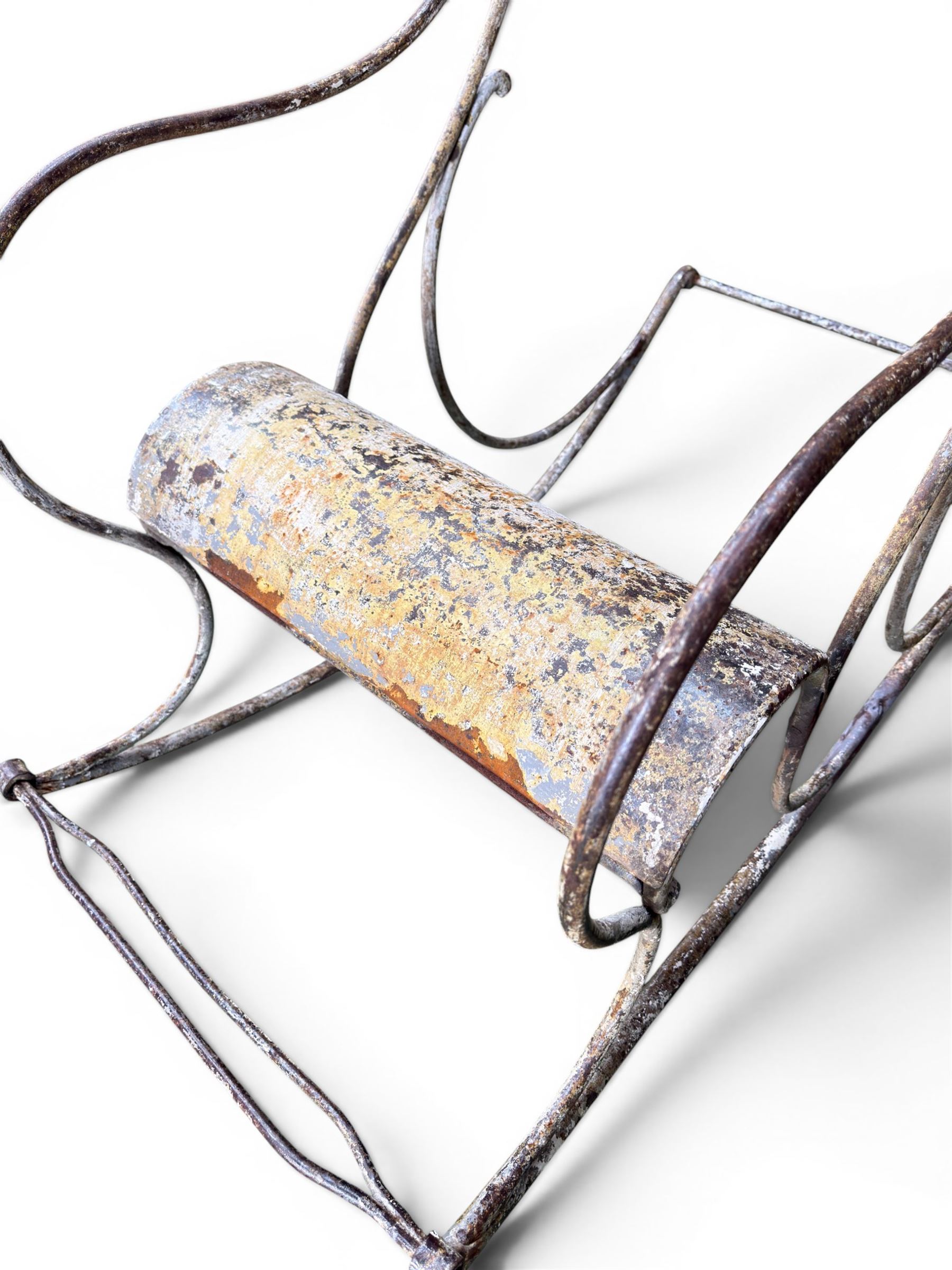 Pair of large unusual 19th century wrought iron garden rocking chairs, simple scroll design, lacking canvas seat