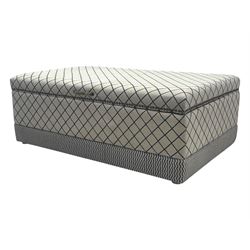 Oka - contemporary mango wood upholstered ottoman, rectangular frame with a printed cotton dhurrie featuring a diamond pattern and wavy stripe border, fitted with brass hinges, decorative studs, and handle