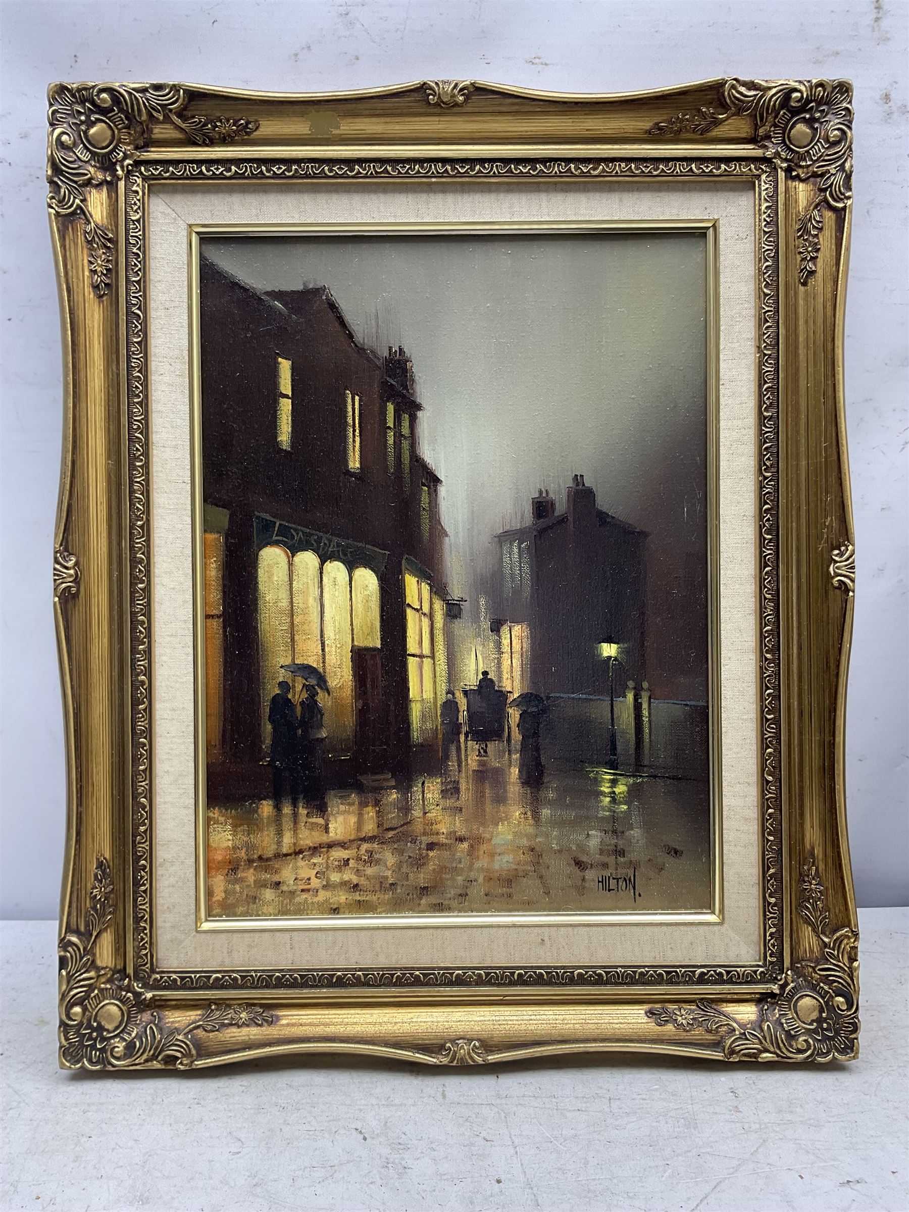 Barry Hilton (British 1941-): Edwardian Street Scene at Night, oil on canvas signed 40cm x 30cm