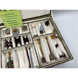 Chinese boxed collection of miniature polished hardstone musical instruments with hardwood stands