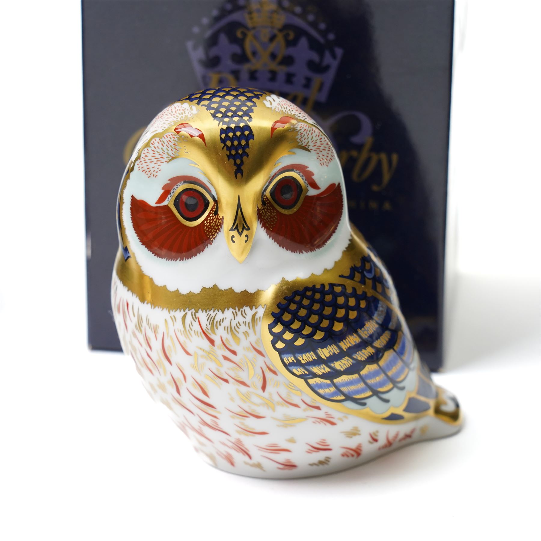 Six Royal Crown Derby paperweights, comprising Robin (unboxed), Robin nesting with gold stopper, Goldfinch nesting with gold stopper, Linnet with gold stopper, Tawny Owl with gold stopper and Crested Tit with gold stopper (6)