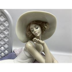Lladro figure, Garden of Dreams, modelled as a woman reclining in front of trellis of flowers on a mahogany base, limited edition 3129/4000, sculpted by  José Puche, with original box, no 7634, year issued 1994, year retired 1996, H32cm
