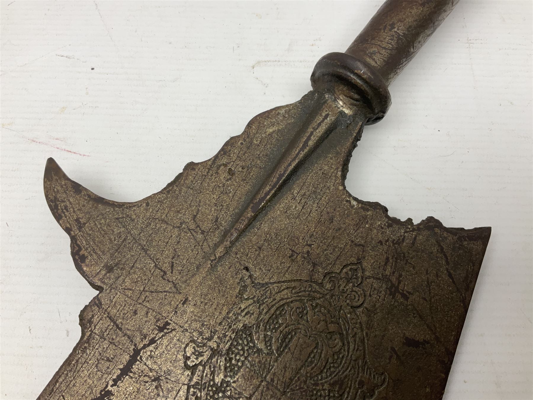 Moroccan jambiya dagger with 24.5cm plain curved blade stamped LONDON to the ricasso area, the hilt and scabbard overlaid with plain sheet brass to the back and ornate silver coloured metal to the front; waisted grip and arched pommel; two pyramid mounts to the scabbard L41cm overall; large billhook with curving blade and stacked leather washer grip; and a reproduction halberd blade (3)