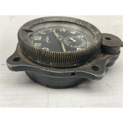 WW2 Jungans Luftwaffe aircraft cockpit clock with luminous centre sweep seconds hand, baton hour and minute hands, regulation 45mm black dial with date recorder, formerly illuminous Arabic numbers and minute track, rotating bezel (seized), going barrel movement with a lever escapement serial No 22901 jewelled to the centre wheel, over-sprung balance with timing  screws, max.H8cm