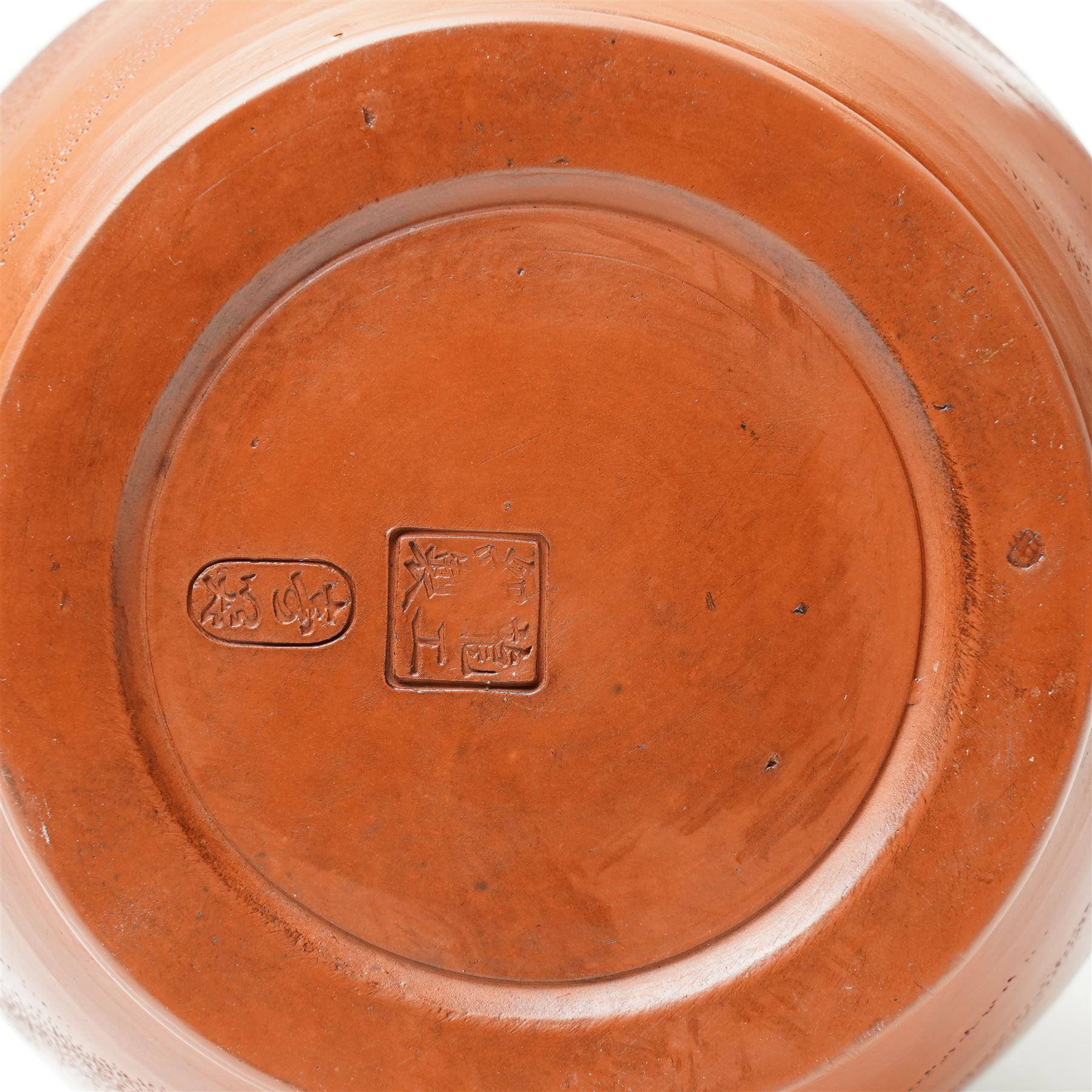 Pair of Chinese redware vases in the Yixing style, early 20th century, decorated with dragons among clouds, one bearing impressed marks to base, H30cm (2)