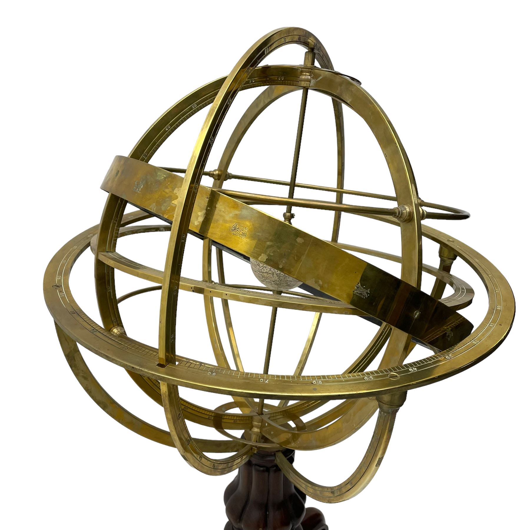 19th century brass terrestrial armillary sphere on rosewood base, lobe carved column on three splayed supports with scrolled carved terminals, the supports united by circular compass with turned stretchers