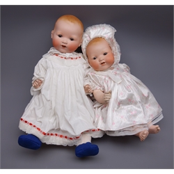  Two Armand Marseille 'My Dream Baby' bisque head dolls, each with moulded hair, sleeping eyes, open mouth with teeth and composition boby with jointed limbs, one marked 'AM Germany 351/71/2K' and one marked 'AM Germany 351/8K', largest H57cm (2)  