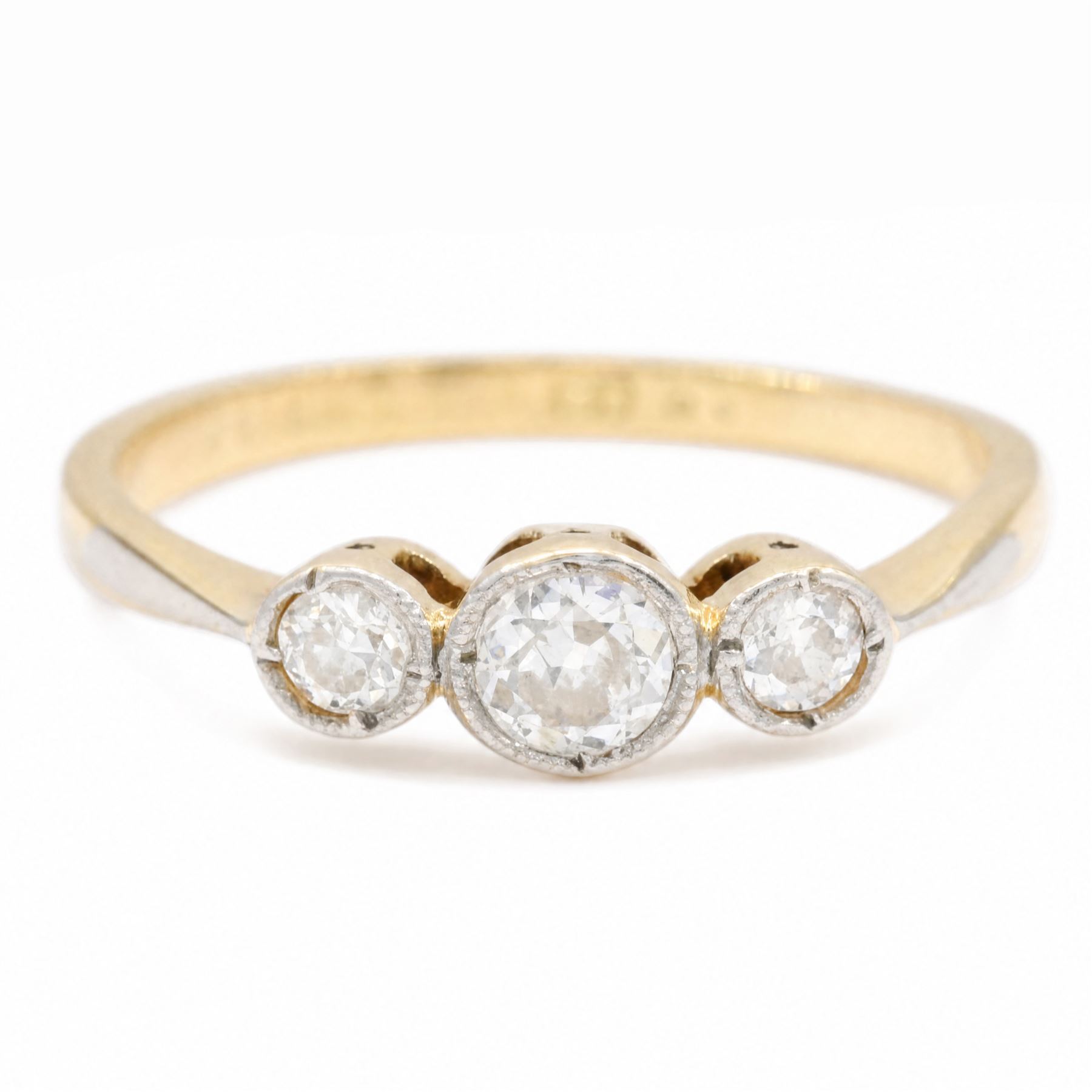 Early 20th century gold diamond ring, milgrain set with three old cut diamonds, stamped 18c Plat, total diamond weight approx 0.25 carat