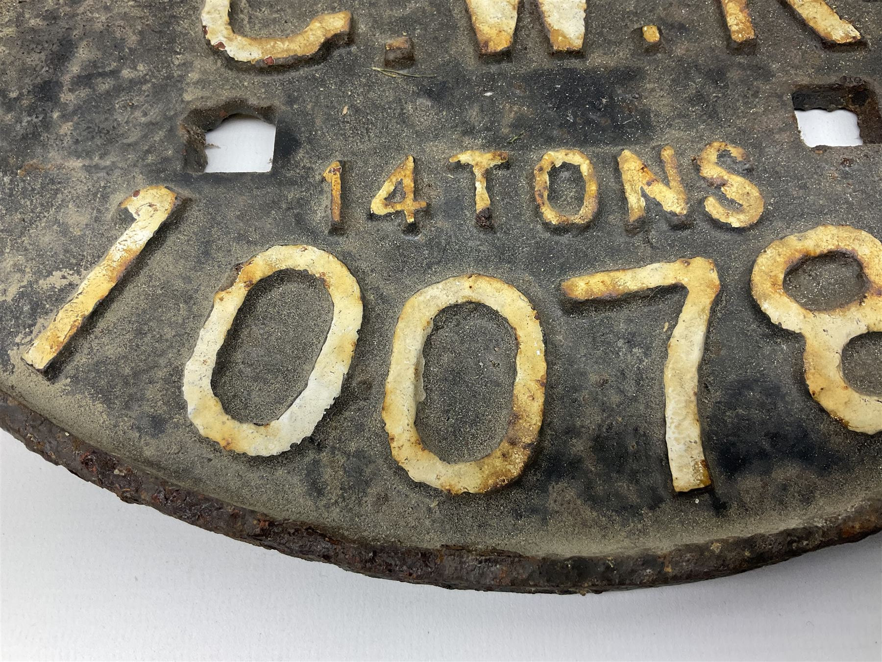 Three cast iron railway wagon plates of D shaped form to include Southern Railway, LMS and GWR, L27.5cm