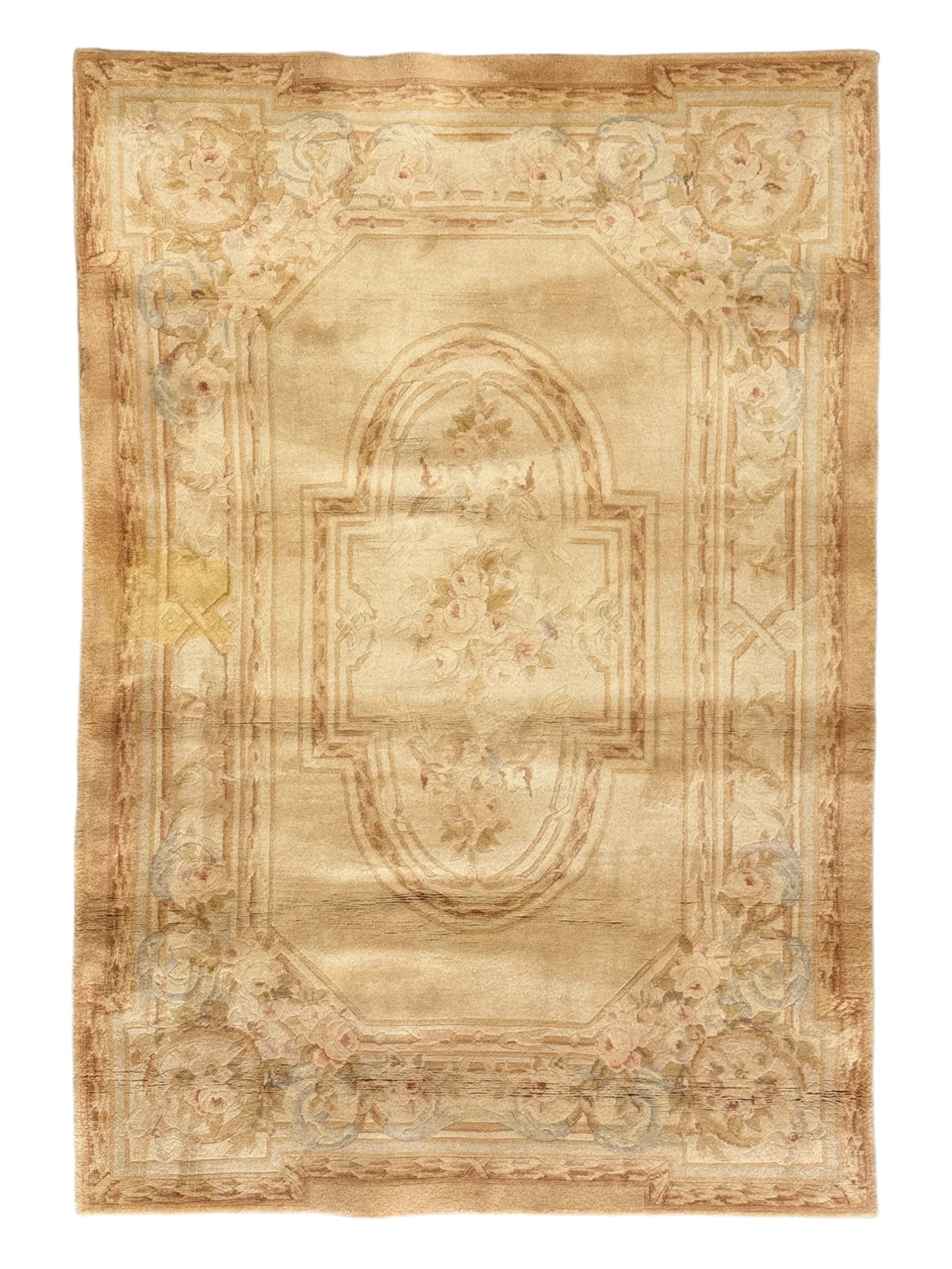 Chinese Savonnerie beige ground rug, central medallion surrounded by scrolling acanthus leaves and floral bouquets in soft pastel hues, wide border with floral garland and vine arrangement, the corners with floral sprays (198cm x 139cm); Chinese Savonnerie beige ground rug, oval central medallion, scrolling acanthus leaf and rose borders, wide band with floral garlands and rococo-design scrolls (198cm x 135cm)