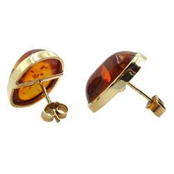 Pair of 9ct gold oval Baltic amber stud earrings, hallmarked 