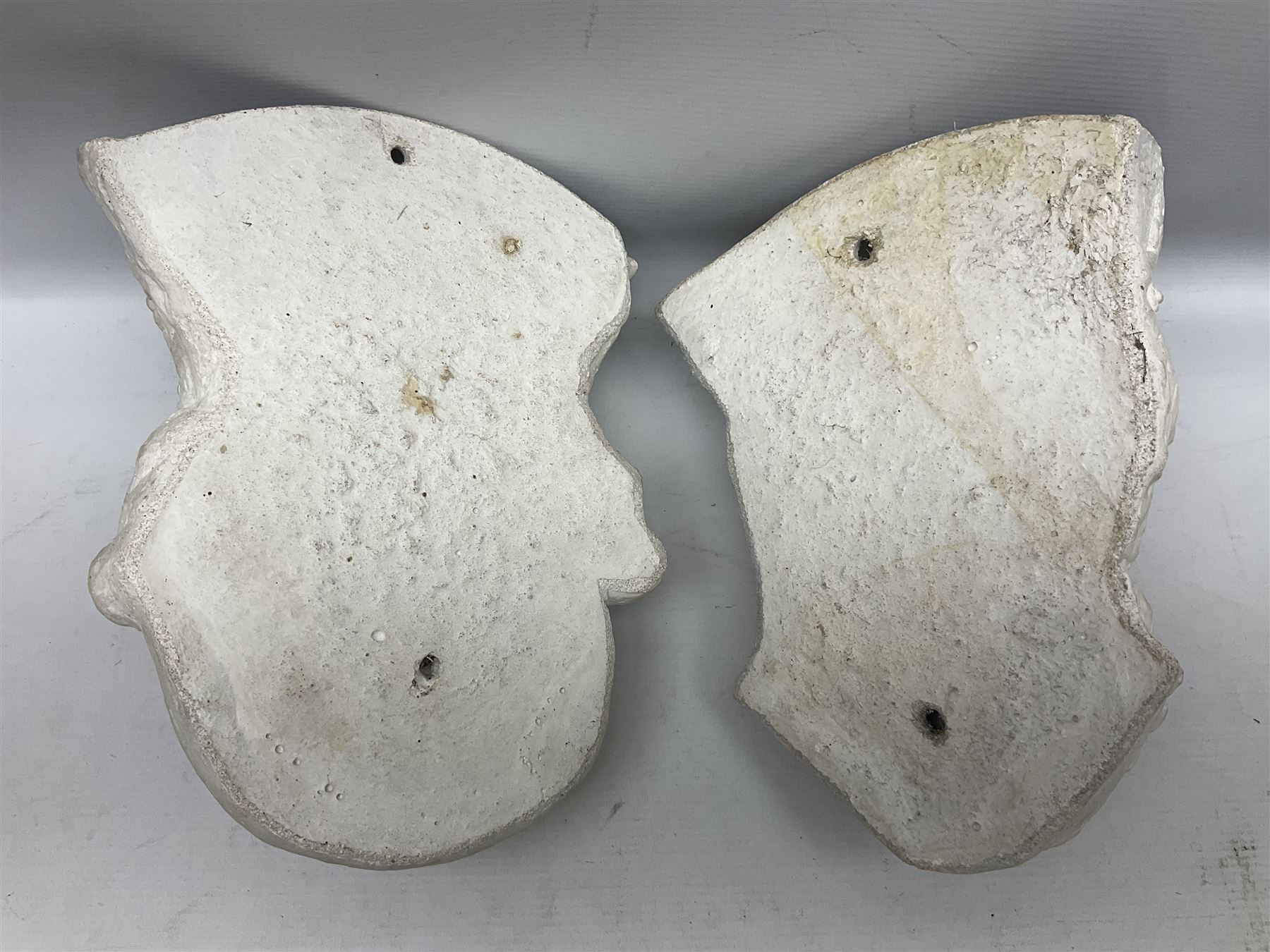 Pair of concrete wall planters in the form of a medieval King and Queen, painted white, L28cm