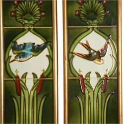 Pair of framed Art Nouveau fireside tile sets, each with five tube-lined tiles one depicting a kingfish, the other a swallow, above bulrushes, with a white lily pond beneath, H79cm
