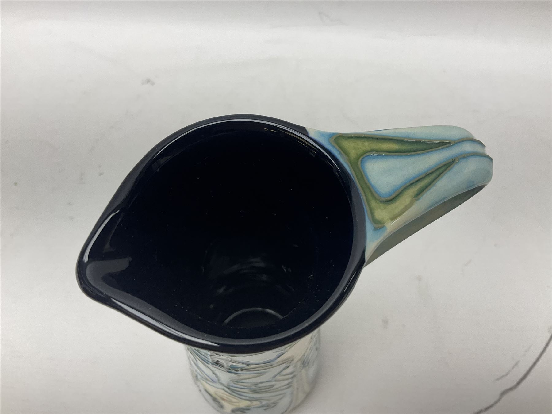 Moorcroft jug, of tapering form, decorated in the Calla Lily pattern by Emma Bossons, circa 2001, H24cm