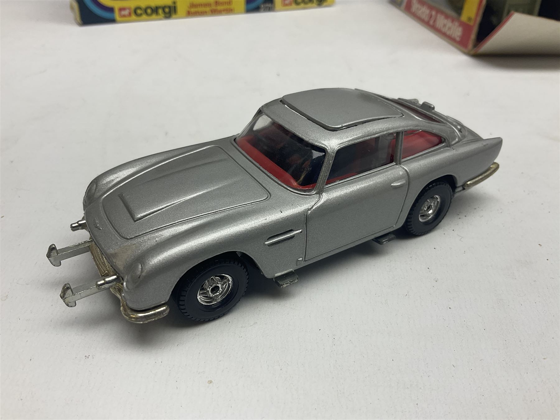 Corgi - die-cast model of James Bond Aston Martin DB5 No.271 with silver body and red interior, gold bumpers and four-spoke wheels, James Bond and two bandit figures; original window box with header card; and Dinky Shado 2 Mobile with one missile No.353; in window box (2)