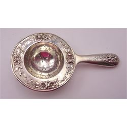 Group of silver, comprising early 20th century continental silver tea strainer, with repousse floral decoration, stamped 930 and with import marks for Chester 1912, pair of Victorian silver napkin rings, with oblique fluted decoration and engraved initials, hallmarked Rolason Brothers, Birmingham 1892, together with an Edwardian pair of open salts, of oval form, with repousse C scroll and foliate decoration, hallmarked Birmingham 1903 and a set of six Edwardian silver handled dessert knives and forks, hallmarked 	James Deakin & Sons, Birmingham 1901