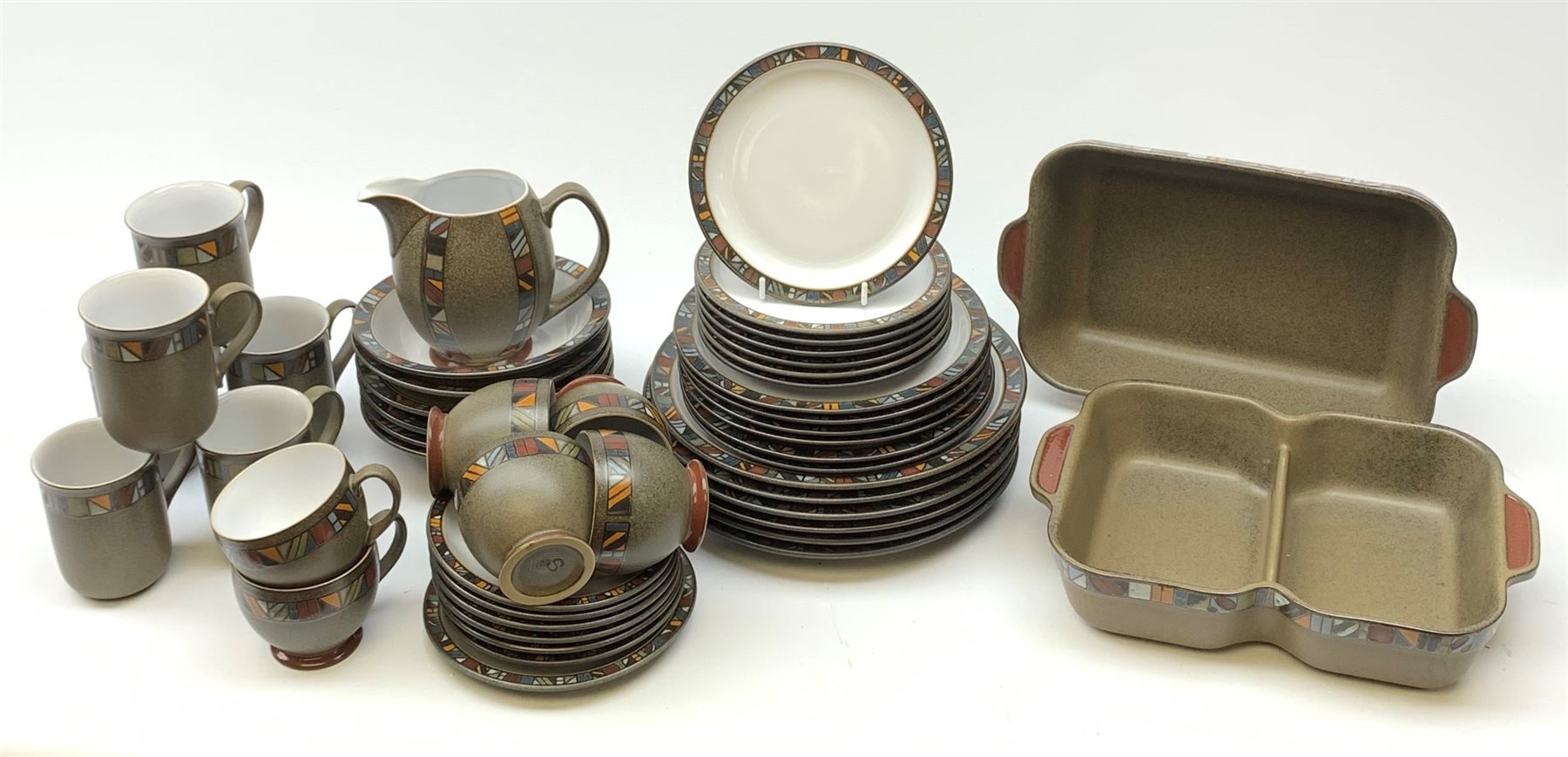 A Denby Marrakesh pattern dinner service, comprising six dinner plates, six dessert plates, seven side plates, two serving dishes, six bowls. six tea cups, six saucers, six coffee mugs, milk jug and saucer.
