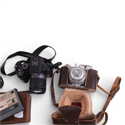 Collection of cameras, lenses and accessories, including Panasonic Lumix DMC-G2, Koroll 24, Coronet folding camera, Halina Zippy F and Vivitar Series 1 lens