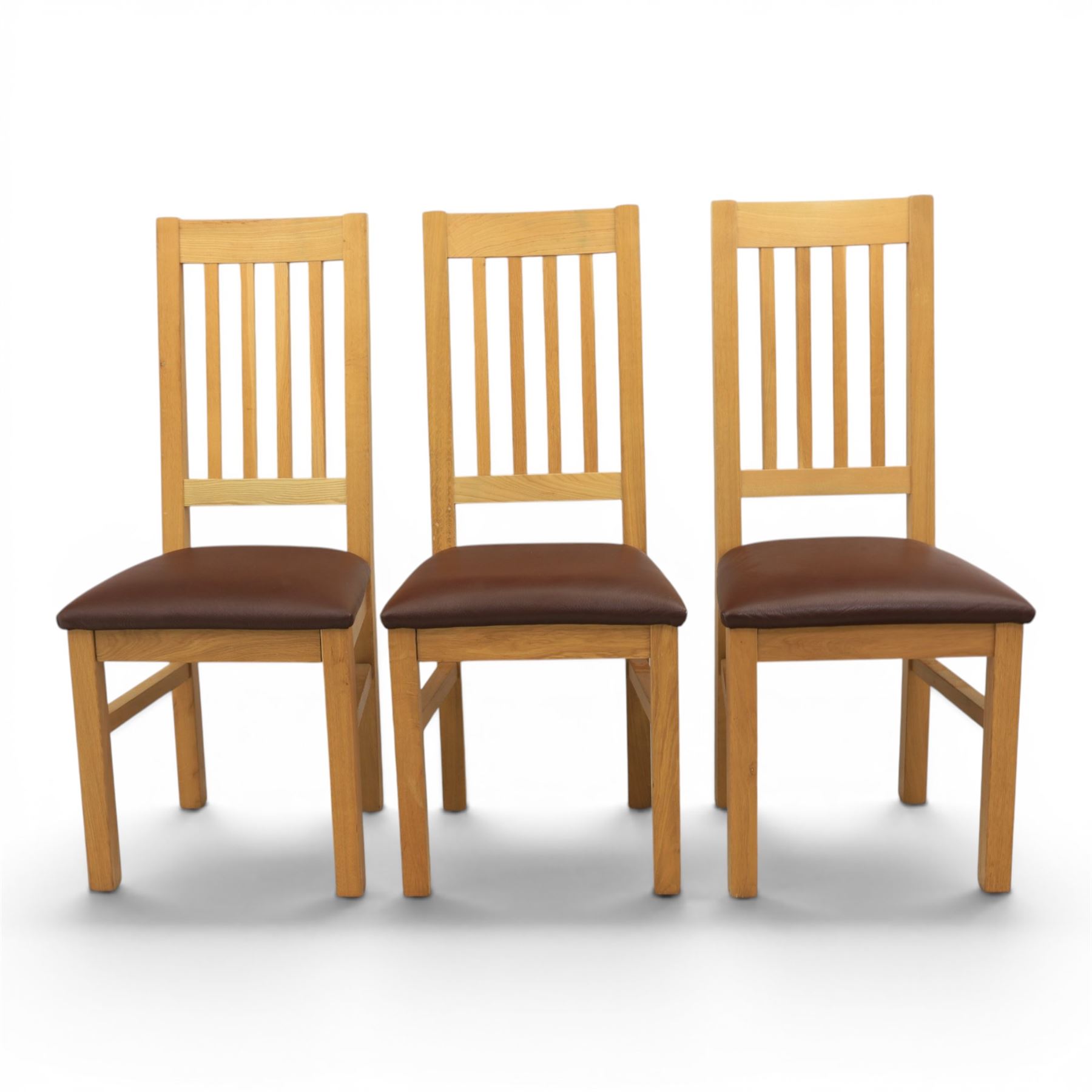Modern solid oak dining table with set six chairs, chairs with brown leatherette seat