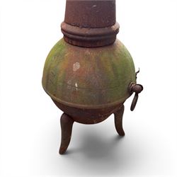 Garden chiminea, with mesh front spark guard, flue chimney on three splayed legs, in a weathered finish