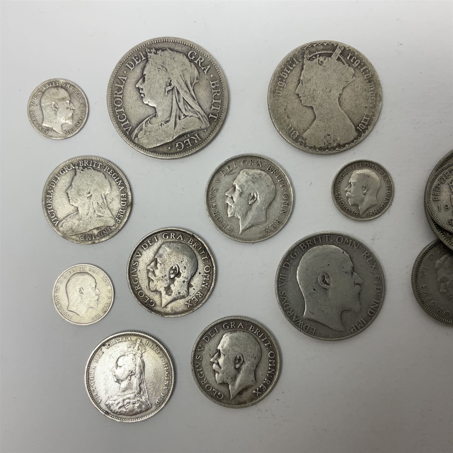 Approximately 65 grams of Great British pre 1920 silver coins and approximately 230 grams of pre 1947 silver coins, including King George V 1935 crown and two King George VI 1937 crowns
