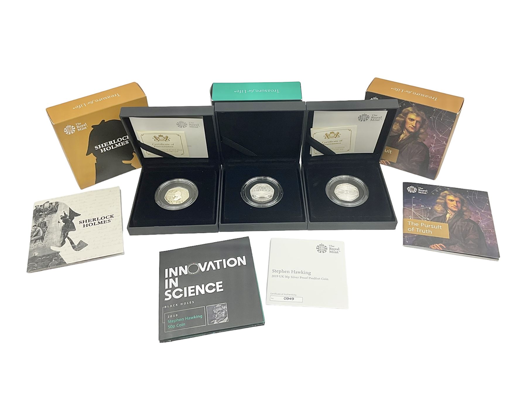 Three The Royal Mint United Kingdom silver proof piedfort fifty pence coins, comprising 2017 'Sir Isaac Newton', 2019 'A Celebration of Sherlock Holmes' and 'Celebrating the Life of Stephen Hawking', all cased with certificates 