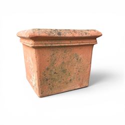 Collection of five terracotta garden planters along with rectangular sandstone trough 