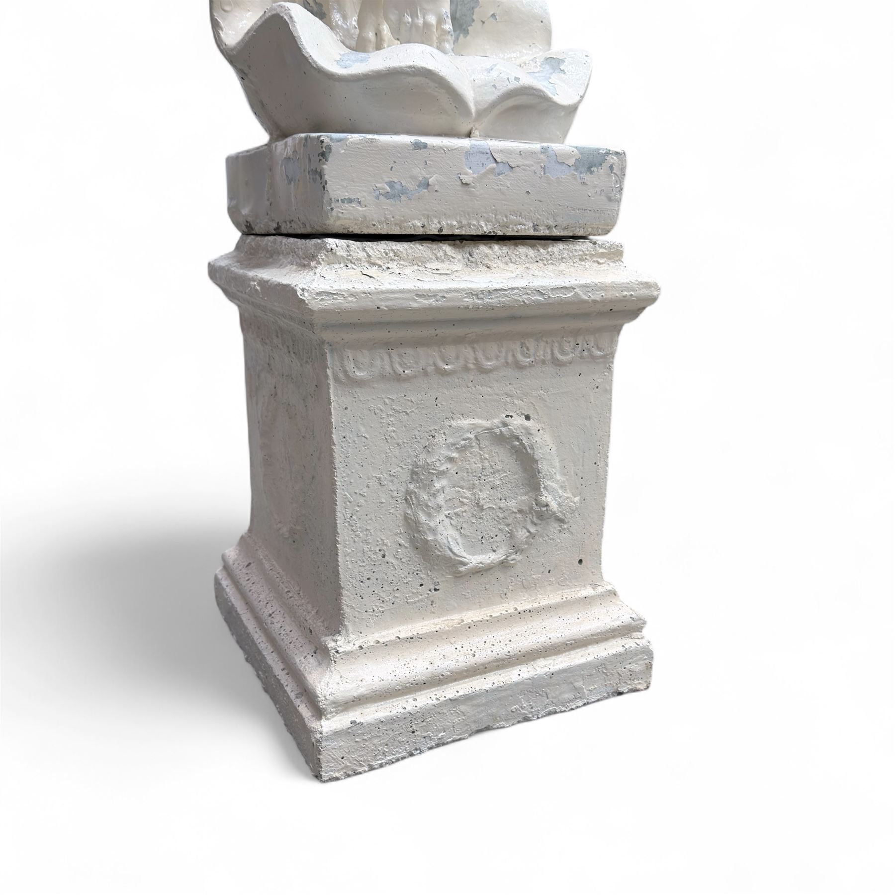 Cast stone garden statue, painted in a white finish on plinth