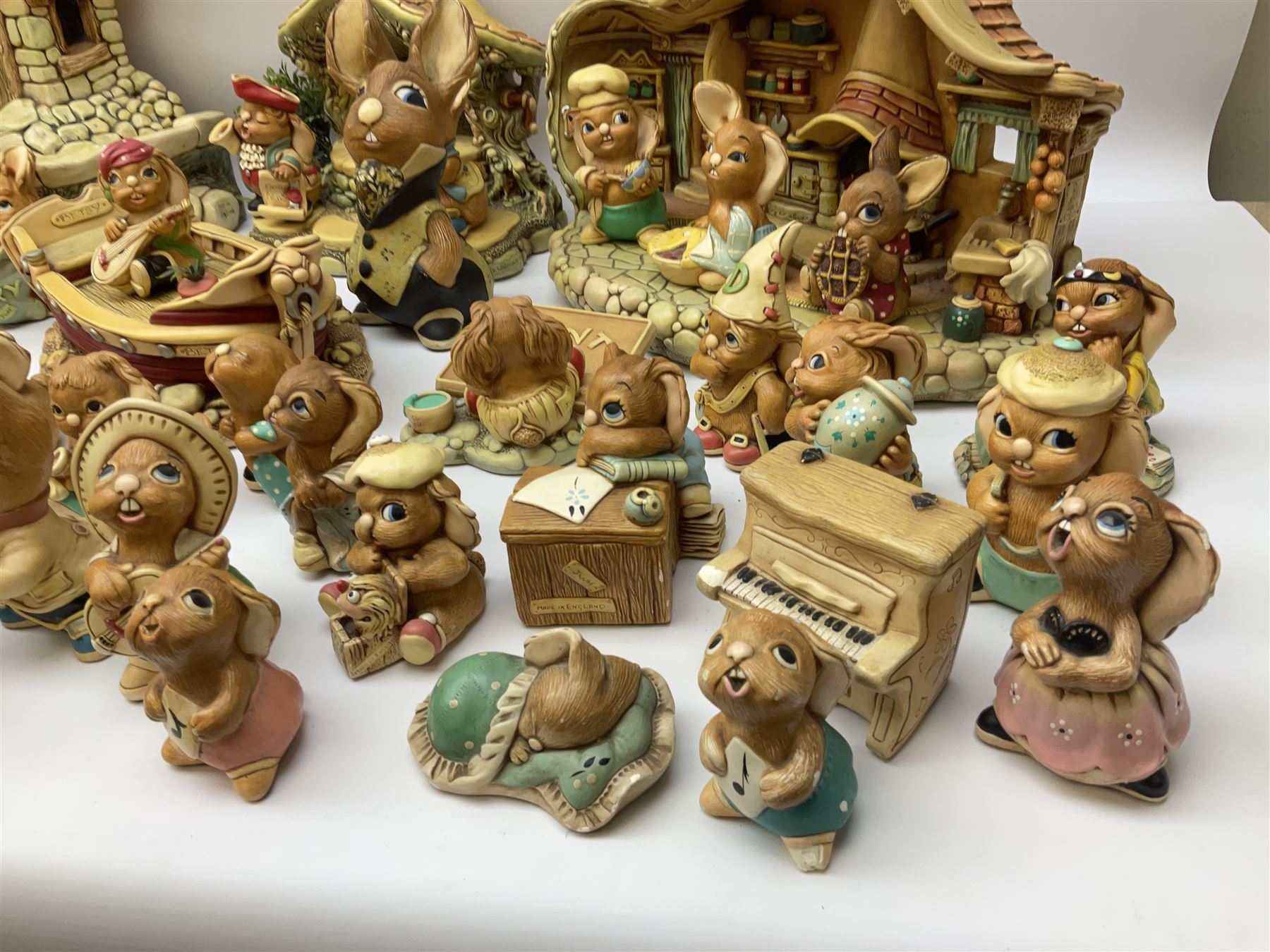 Extensive collection of Pendelfin rabbits and stands, to include Betsy Barge, Fruit Shop, Uncle Soames, Event Piece etc, many with original boxes 