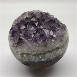 Pair of amethyst geode spheres, with purple crystalline internal formations, D9cm