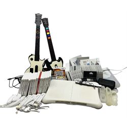 Nintendo Wii console, four controllers with cases and four nunchucks, Wii sensor bar, balance board and dance mat. Guitar hero wireless guitar for Wii and Redoctane wired guitar. Nintendo DS lite handheld gaming console, console and game cases and Guitar Hero Redoctane Guitar Grip. Selection of Nintendo Wii and Nintendo DS lite games to include Super Mario Galaxy, Guitar Hero, Wii Fit, Legend of Zelda games etc. Archos AV400 Series pocket video recorder with accessories, cradle and remote, in three boxes